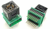 Image of a PLCC (Plastic Leaded Chip Carrier) to DIP (Dual In-line Package) programming adapter. The adapter features a compact, rectangular base with multiple precision pins aligned for DIP socket insertion on the bottom side, and a specialized PLCC socket on the top for securely accommodating PLCC chips. This high-quality adapter facilitates seamless conversion and programming of PLCC chips in DIP-compatible devices, ensuring reliable connectivity and ease of use for electronics development and testing.